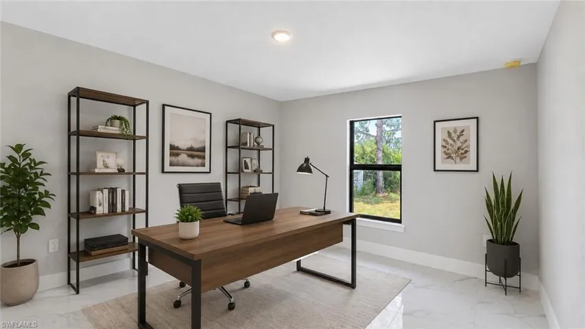 Bright room featuring light gray walls, white baseboards, a single window with black trim, and light-toned tile flooring