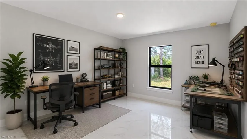 Spacious room featuring light-colored flooring and a large window