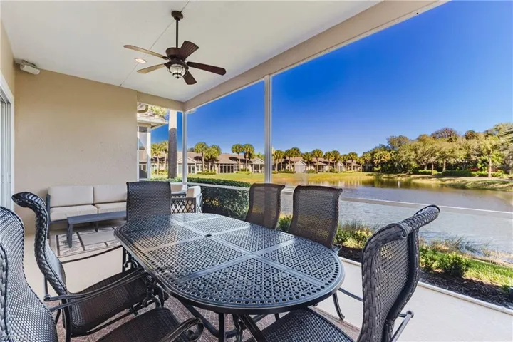 View of patio / terrace featuring ceiling fan, outdoor lounge area, a water view, and a residential view