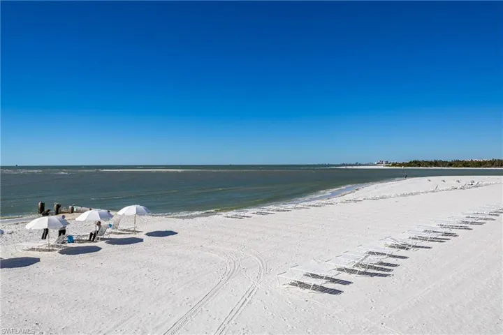 Private Island Beach with chairs, umbrellas, restrooms and screened picnic area