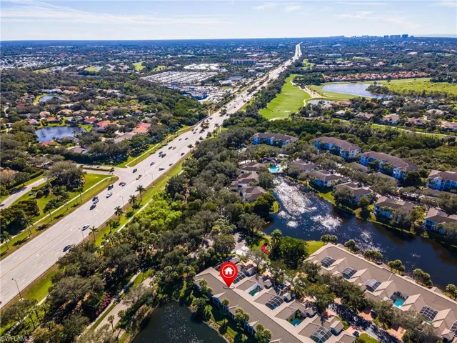 Aerial view of property's location with a nearby body of water