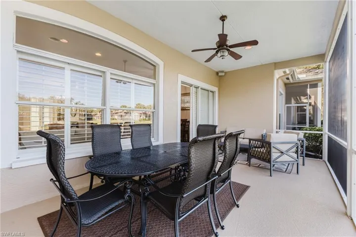 Sunroom featuring a ceiling fan and outdoor dining area
