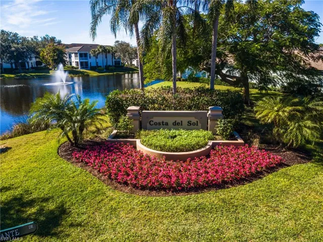Community / neighborhood sign Costa del Sol, featuring a water view and open common area