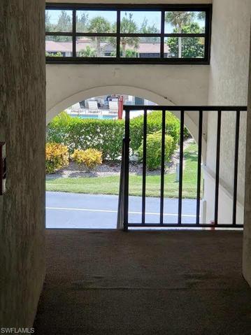 Hallway looking out towards entrance to pool