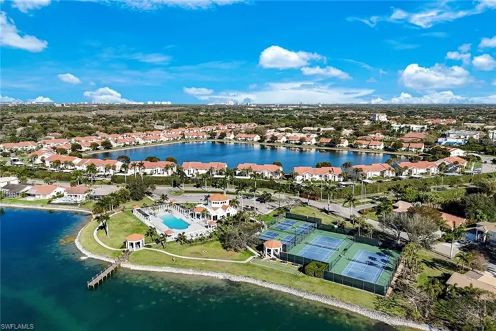 Aerial overview of property's location with a nearby body of water and nearby suburban area