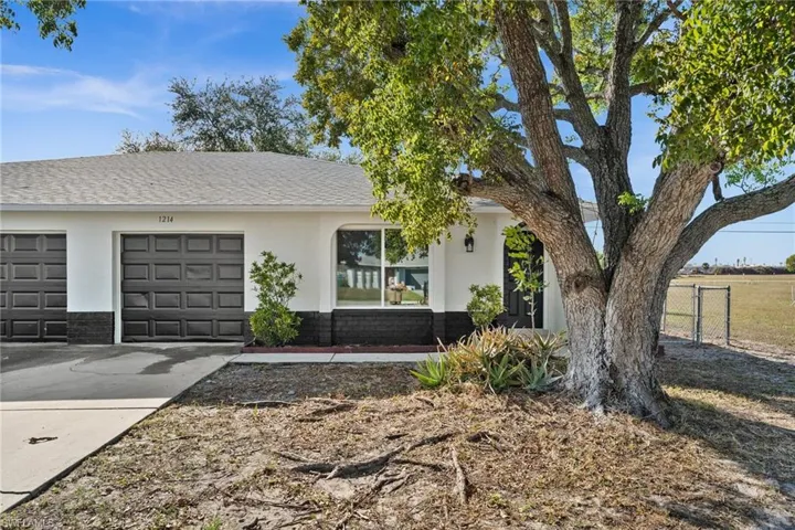 Ranch-style home featuring a garage