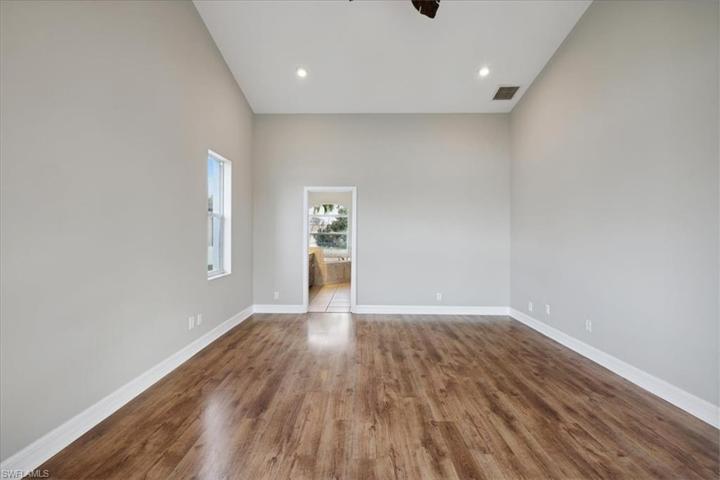 A lovely wood grained laminate & more vaulted ceilings