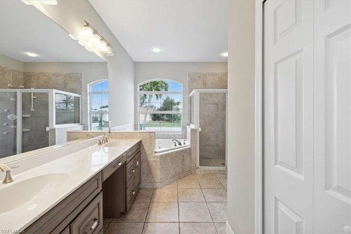 Dual sinks, a large soaking tub and a separate stand-up shower