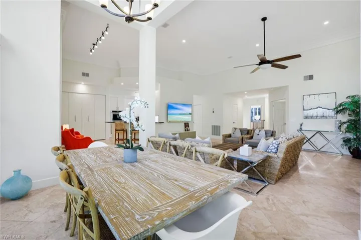 Dining room featuring crown molding and ceiling fan