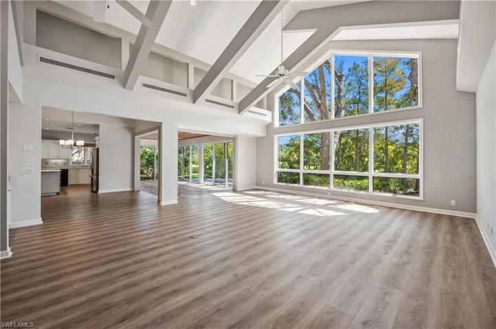 Large living room opens to dining area & kitchen and sunroom.
