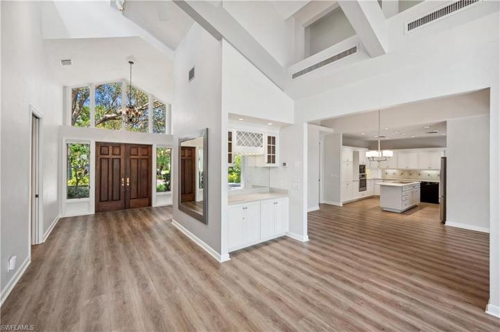 Lovely solid wood double doors & vaulted ceilings.