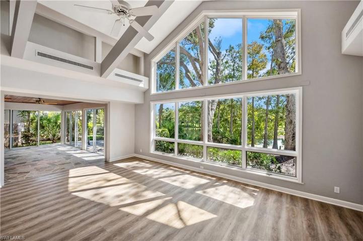 Captivating living space with 20' ceilings & wall of windows.