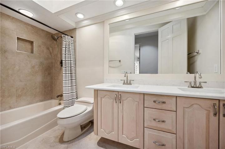 Second full bathroom, with updated bath tile & vanity countertop.
