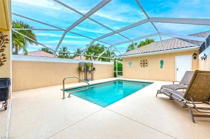 View of pool featuring a lanai and a patio area