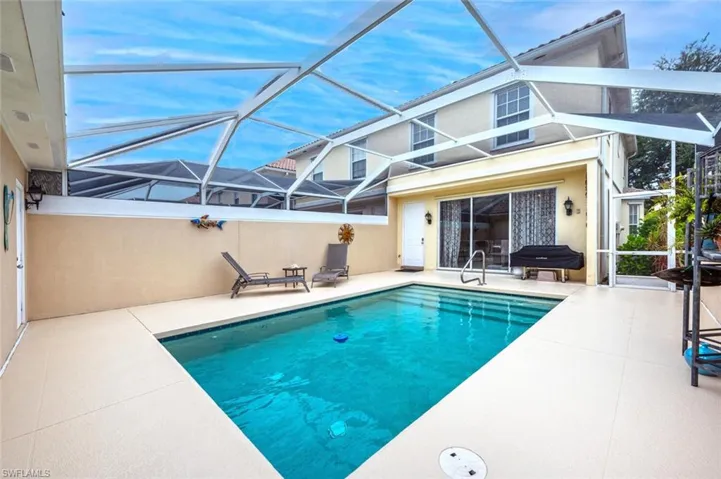 View of pool featuring a patio and a lanai