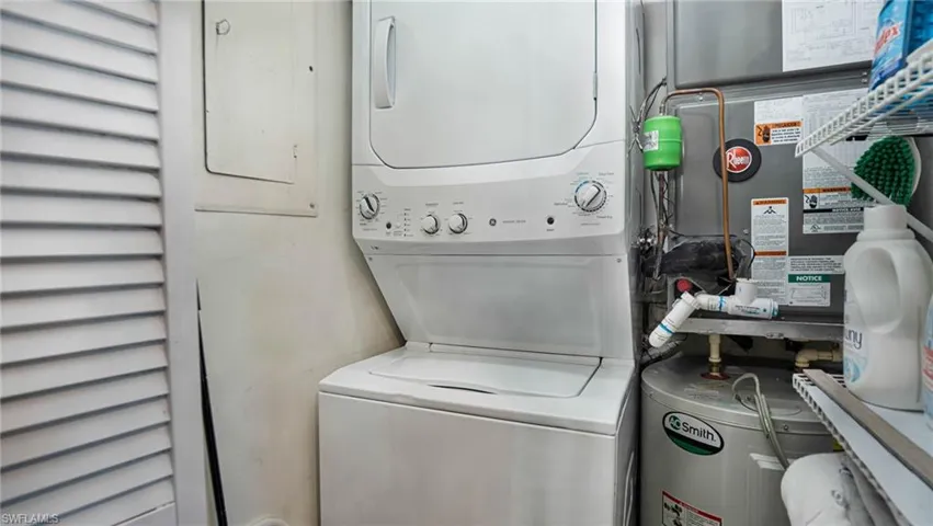 Washroom featuring stacked washer and dryer