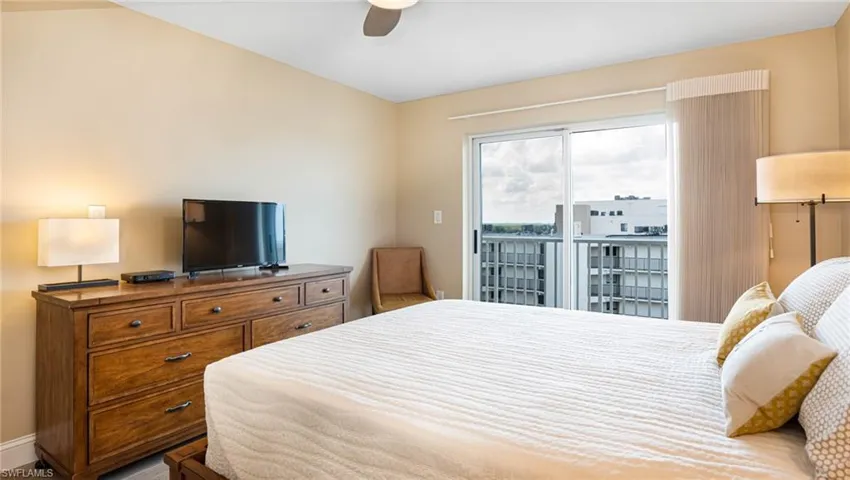Bedroom featuring access to outside and ceiling fan