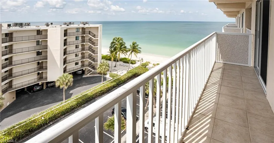 Back Balcony with a beach view and a water view