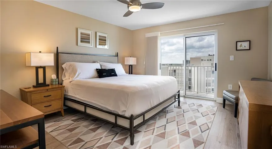 Bedroom featuring ceiling fan, light wood-type flooring, and access to outside