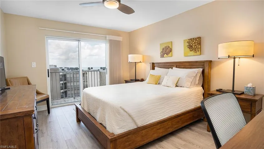 Bedroom with ceiling fan, light hardwood / wood-style flooring, and access to outside