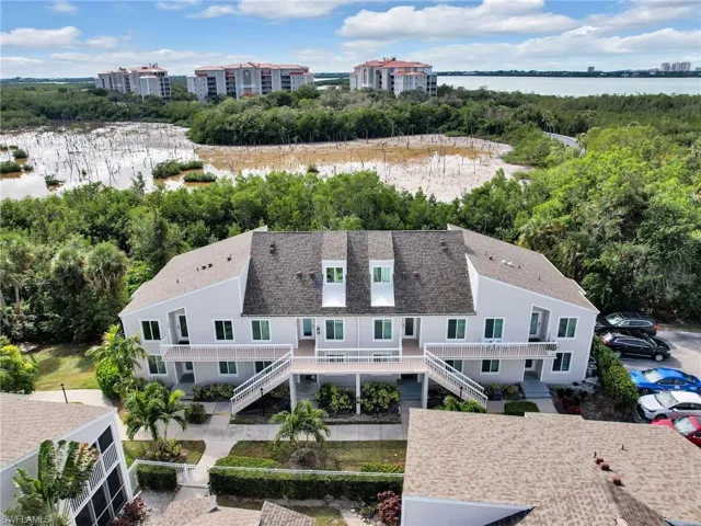 Birds eye view of property featuring a water view