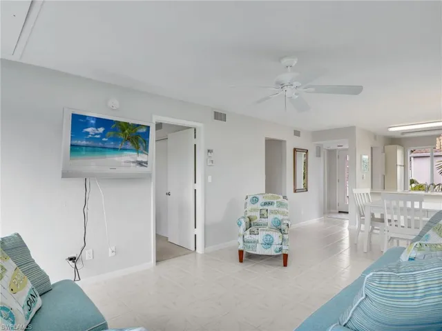 Living room featuring ceiling fan