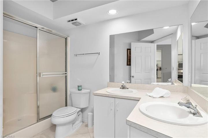 Master bath includes dual sinks and tub/shower combo.