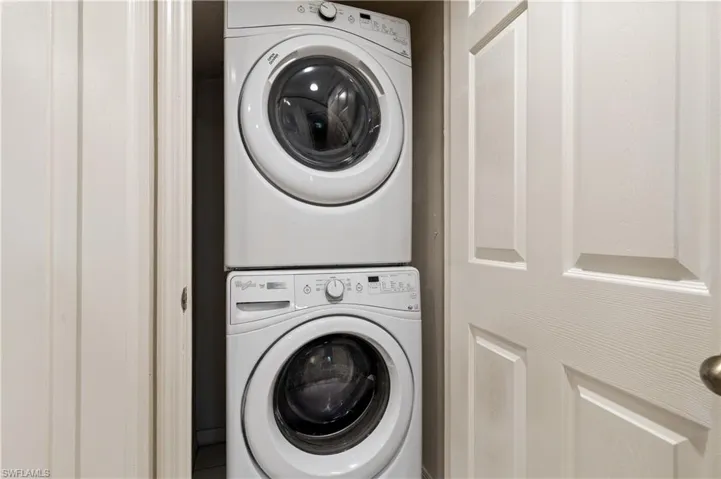 Laundry area featuring stacked washer / dryer