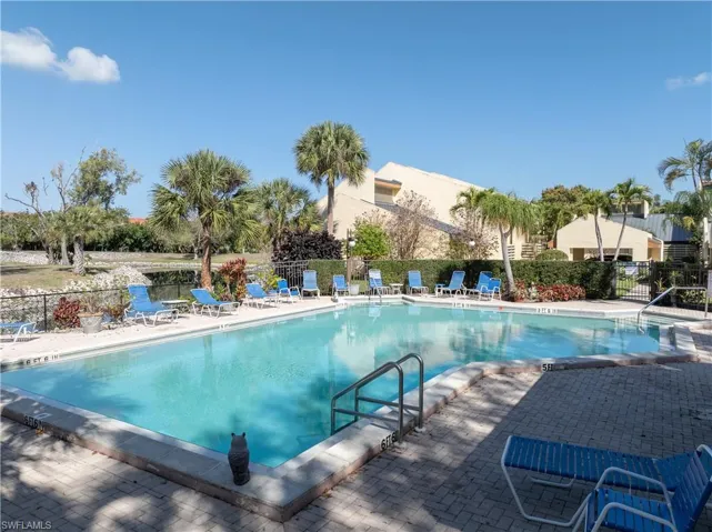 Community pool with a patio area