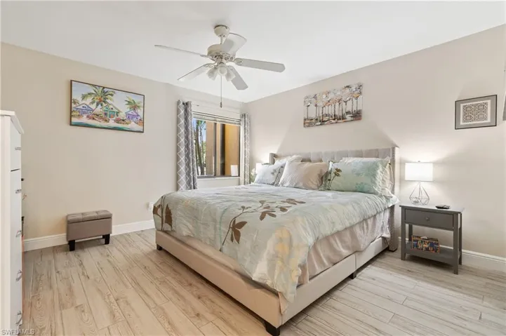 Bedroom featuring light wood-type flooring and a ceiling fan