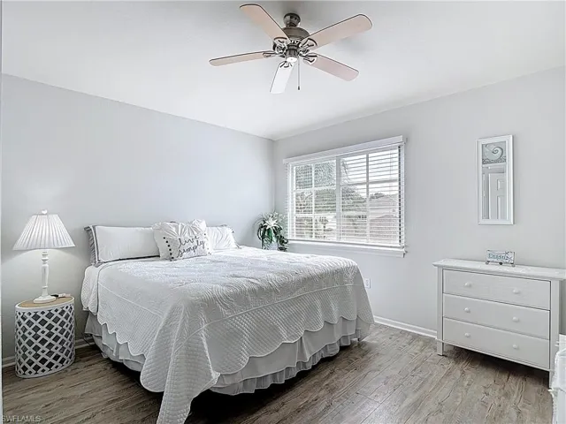 Bedroom with light wood-type flooring and ceiling fan