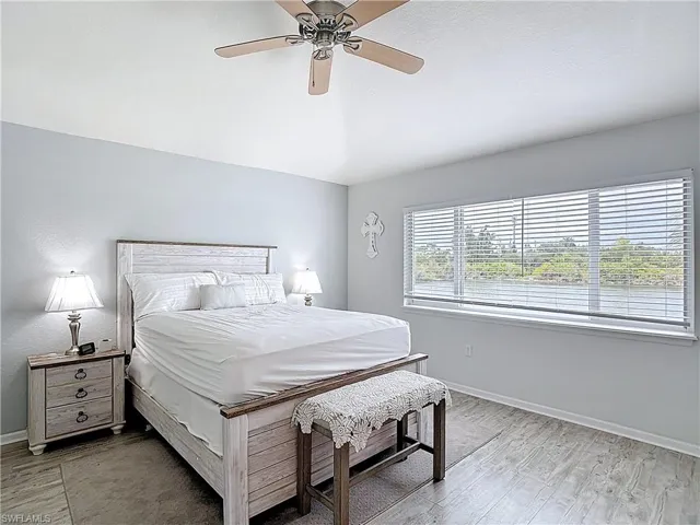 Bedroom featuring a ceiling fan and light wood-type flooring
