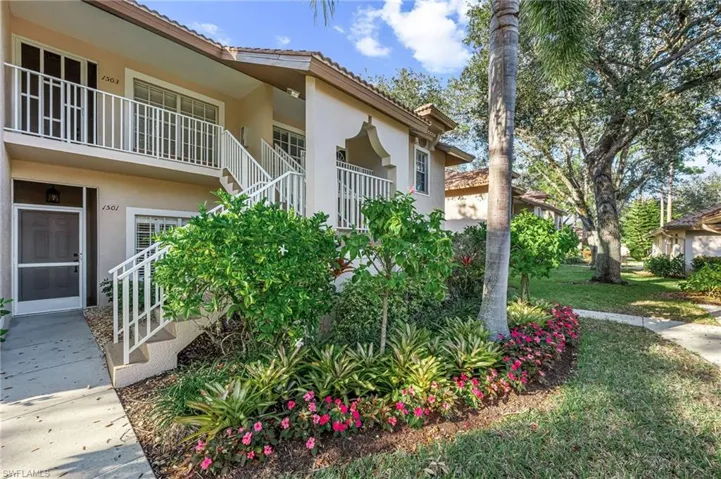 Surrounding community featuring stairs and a balcony