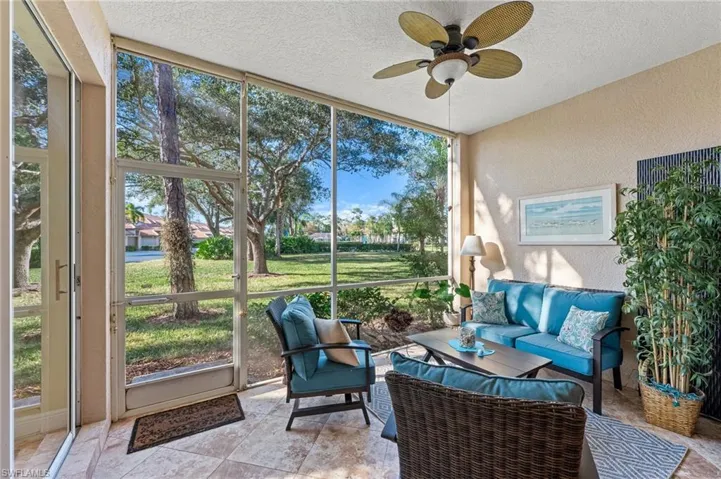 Sunroom featuring an outdoor living space and ceiling fan