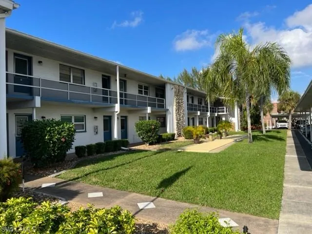 View of community featuring a yard