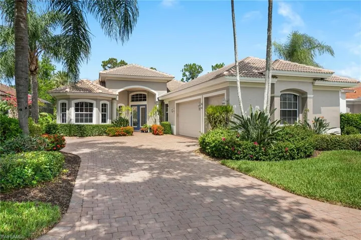 Mediterranean / spanish-style house with a garage