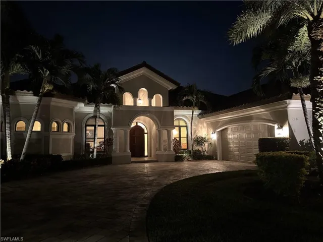 Mediterranean / spanish house featuring a garage