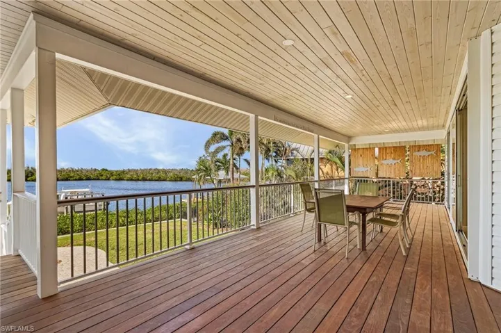 Wooden terrace featuring a water view