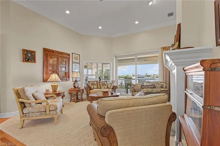 Living room featuring ornamental molding and light wood-type flooring
