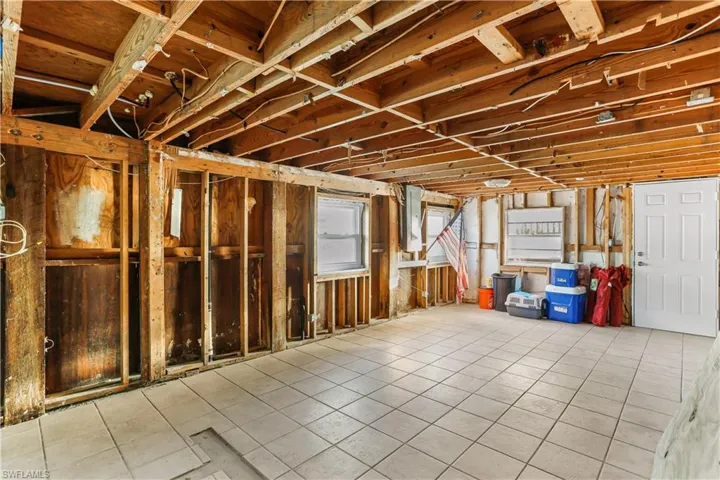 Basement featuring light tile patterned floors