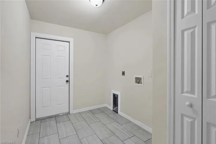 Laundry room featuring hookup for a washing machine and electric dryer hookup