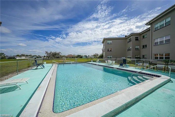 Community pool featuring a patio area