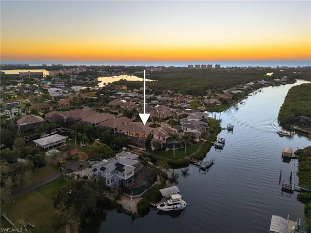 5 minutes away from Barefoot Beach/Bonita Beach & offers easy Gulf access through Wiggins Pass or New Pass from your 7,500 lb. boat lift with an oversized extended dock.