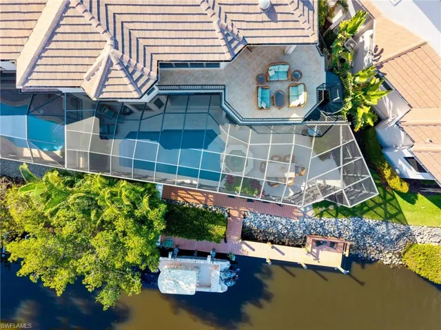Light, bright & coastal home is nestled just off the Imperial River with stunning water views of dolphins splashing & boats sailing by to the Gulf!