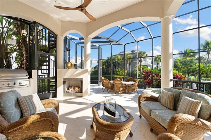 Relax and unwind on the approximately 1520 sq ft pool deck with pool nearly twice the size of the average villa home, spa & covered seating area with grill & fireplace, all overlooking the canal & river beyond.