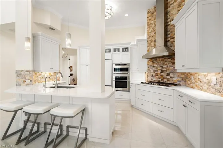 Meticulously crafted from the beautifully renovated coastal contemporary kitchen & dramatic great room with soaring 2-story lofted ceilings to the gorgeous tile & white oak wood floors!