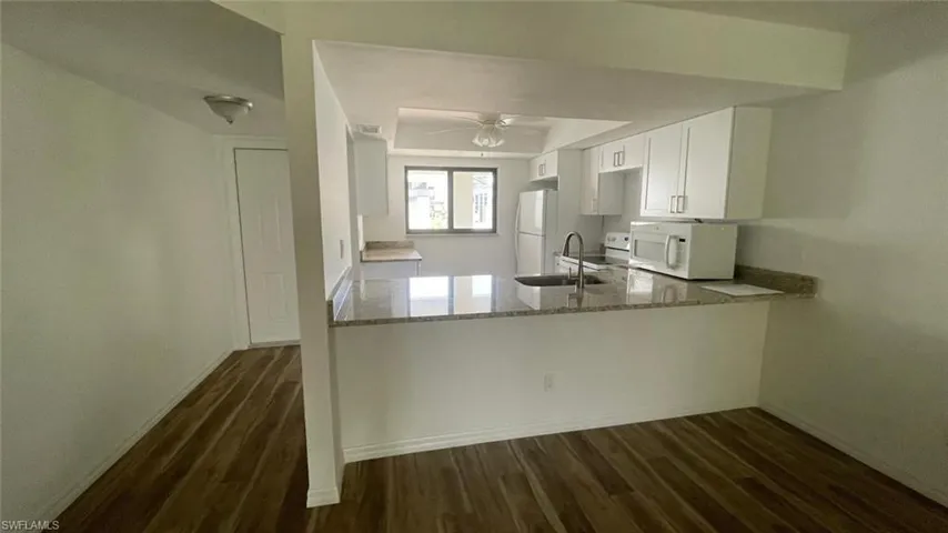 Kitchen featuring white cabinets