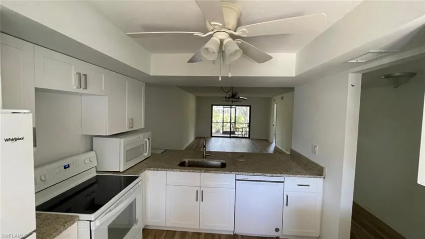 Kitchen featuring white appliances