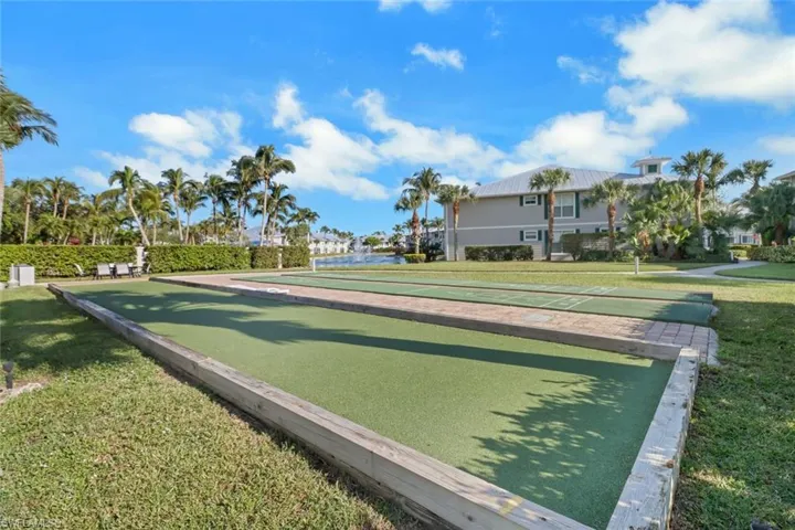 View of property's community featuring a lawn