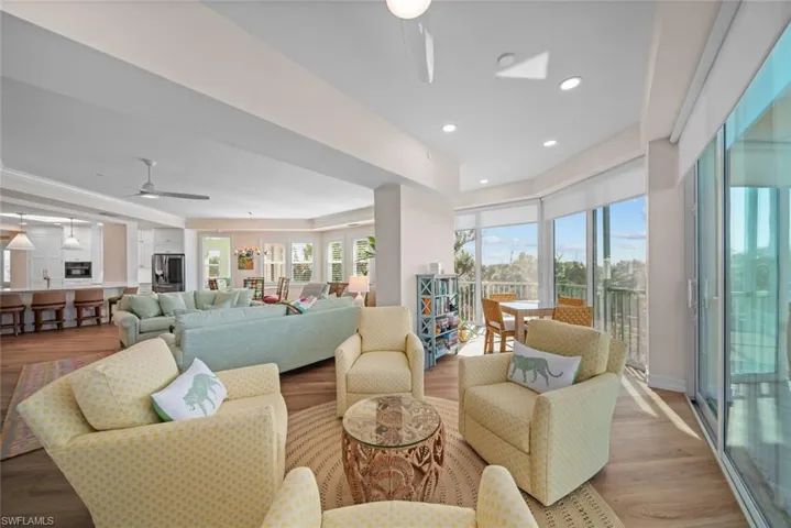 Living room featuring ceiling fan and light wood-type flooring